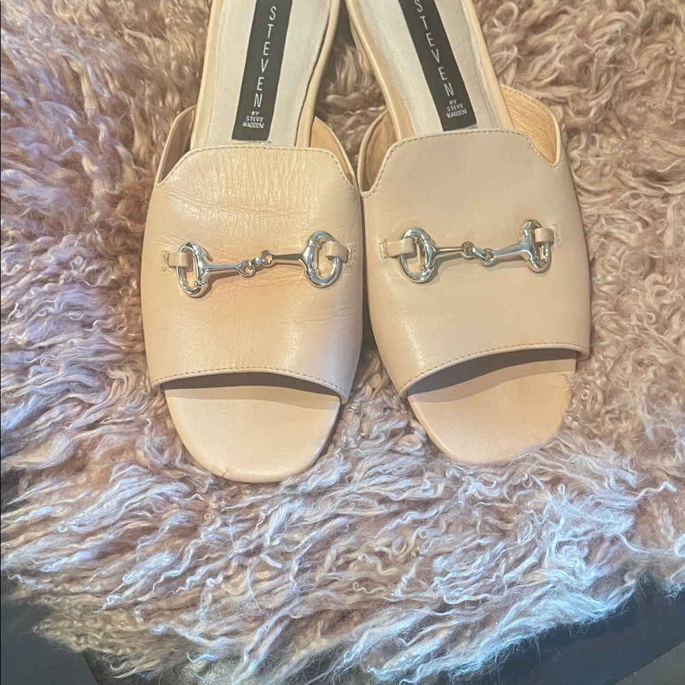 Steven Women's Tan Sandals with gold horsebit accents.